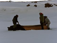 01A Our Crew Gather The Wooden Foundations To Our Tents After Arriving At Our Bylot Island Camp On Floe Edge Adventure Nunavut Canada
